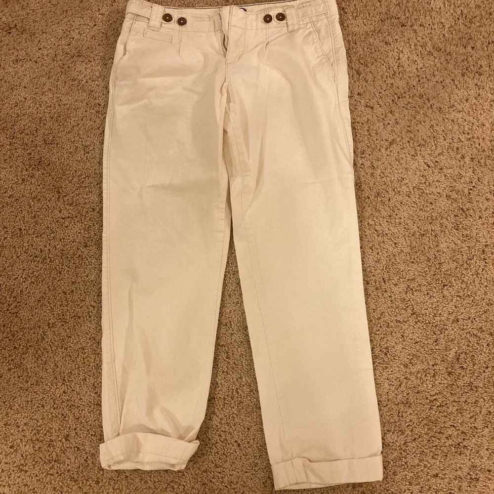 Cute whitish cream pants. Love the buttons!